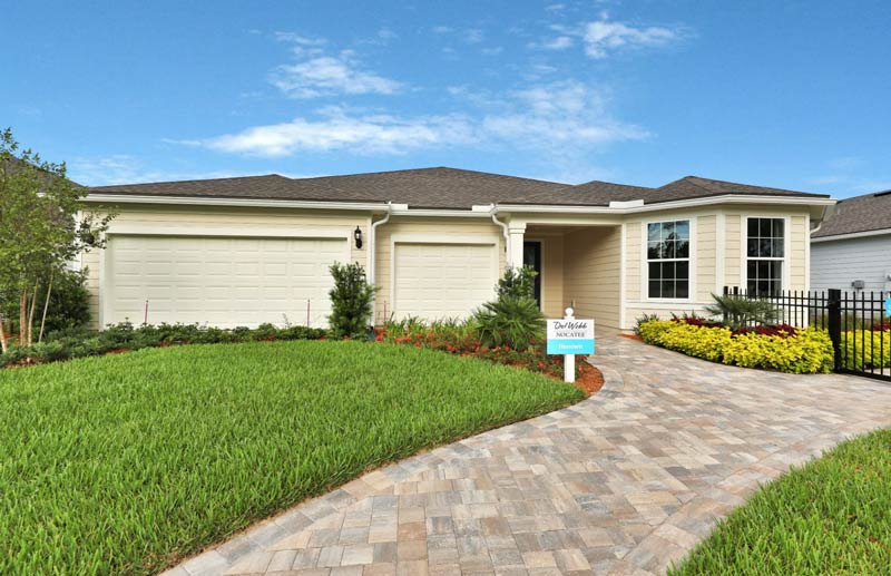 Single family home for sale in Nocatee, with a nice green yard and clear blue sky.